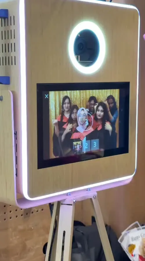 Guests posing on the instant print photobooth screen
