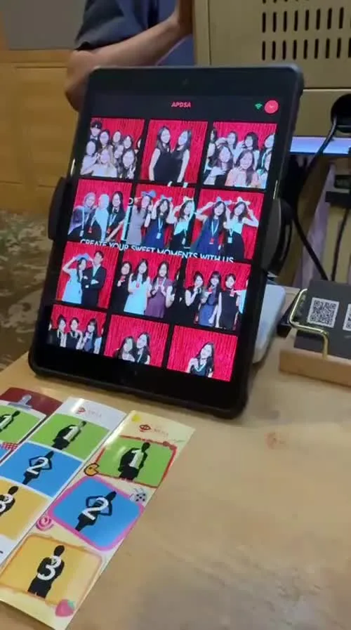 Photo sharing tablet and printed photo strips, included in the Combo experience